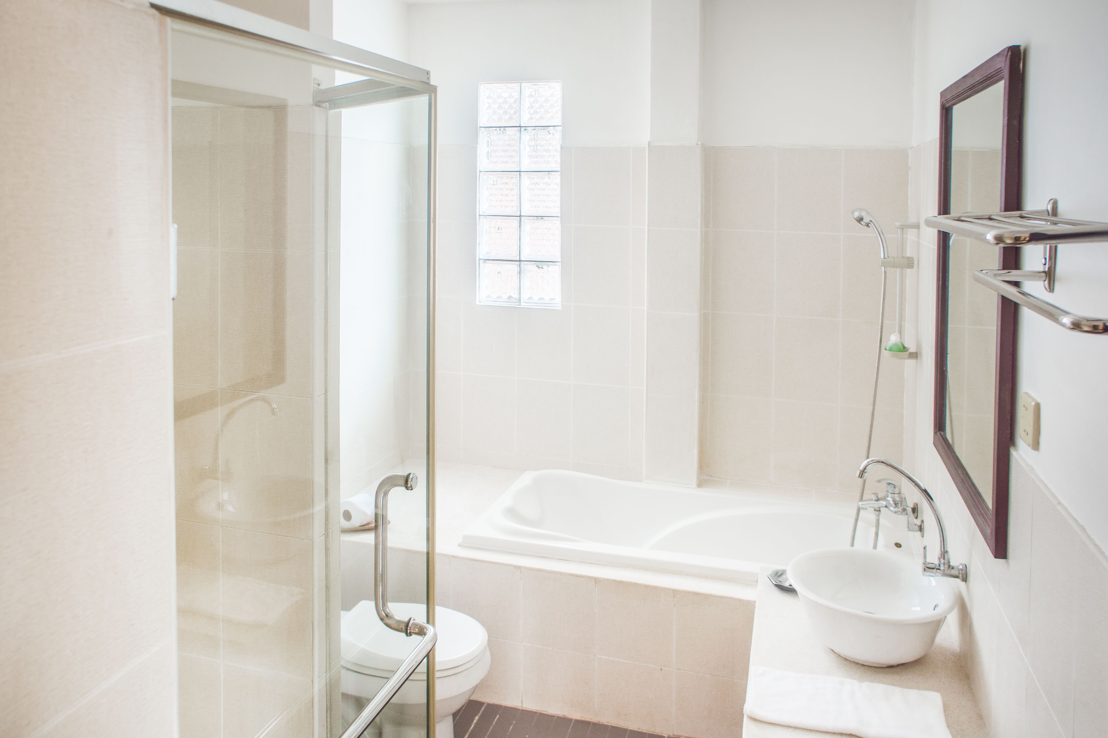 shower, hair dryer, slippers, towels