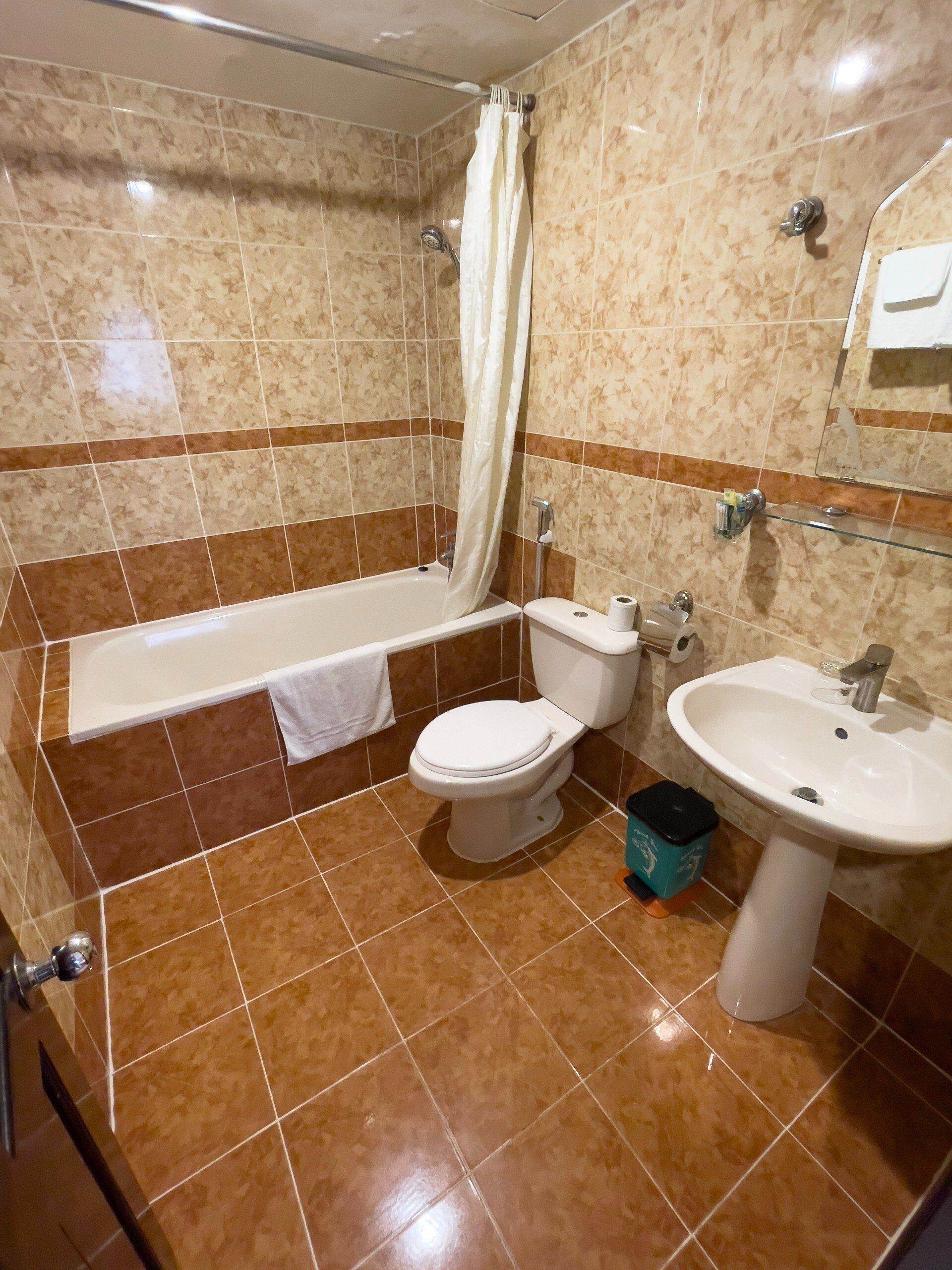 deep-soaking bathtub, free toiletries, hair dryer, slippers