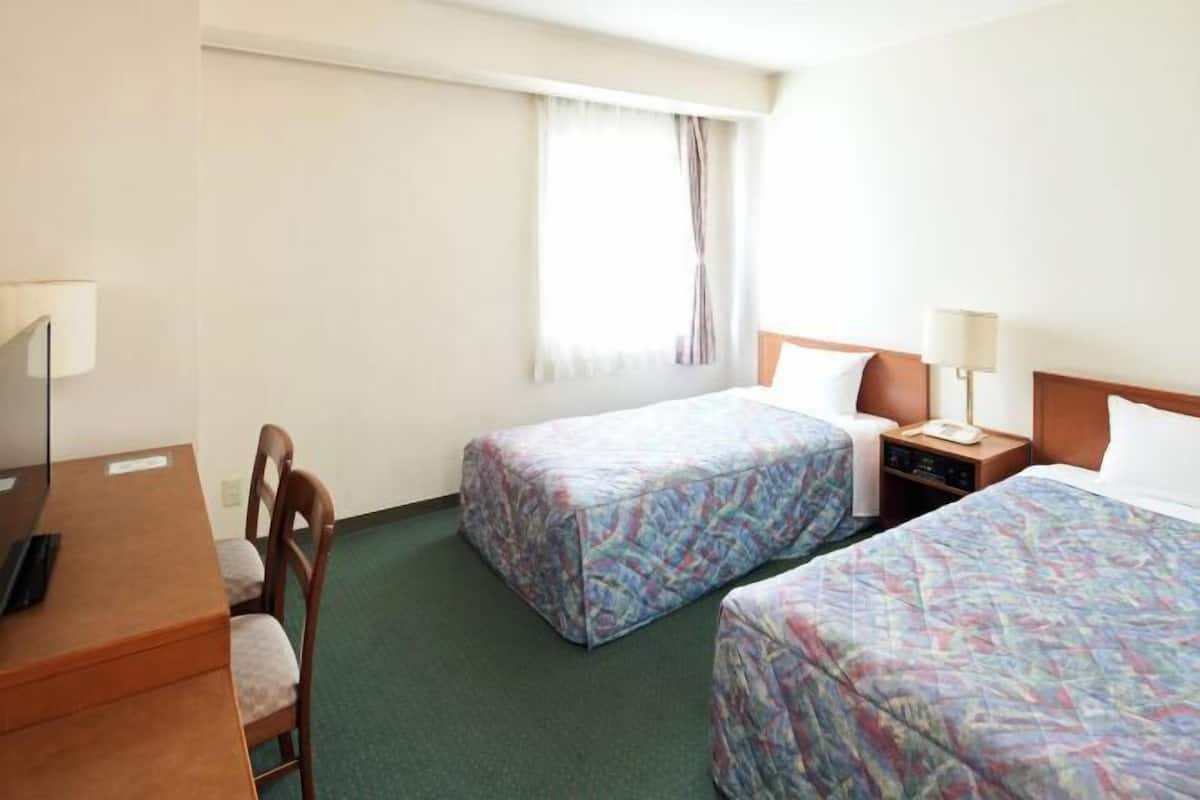 Desk, blackout curtains, iron/ironing board, bed sheets
