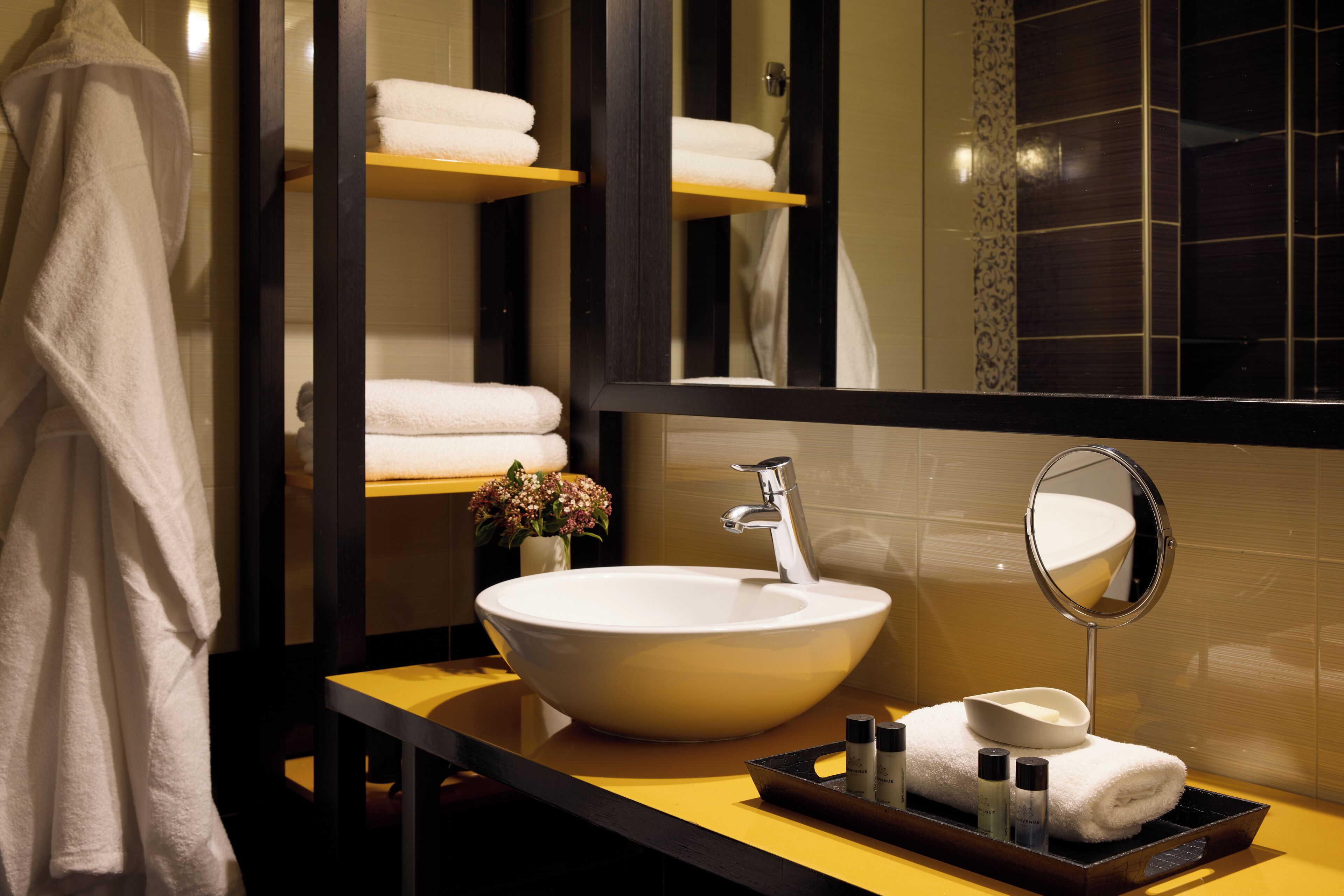 designer toiletries, hair dryer, bathrobes, slippers