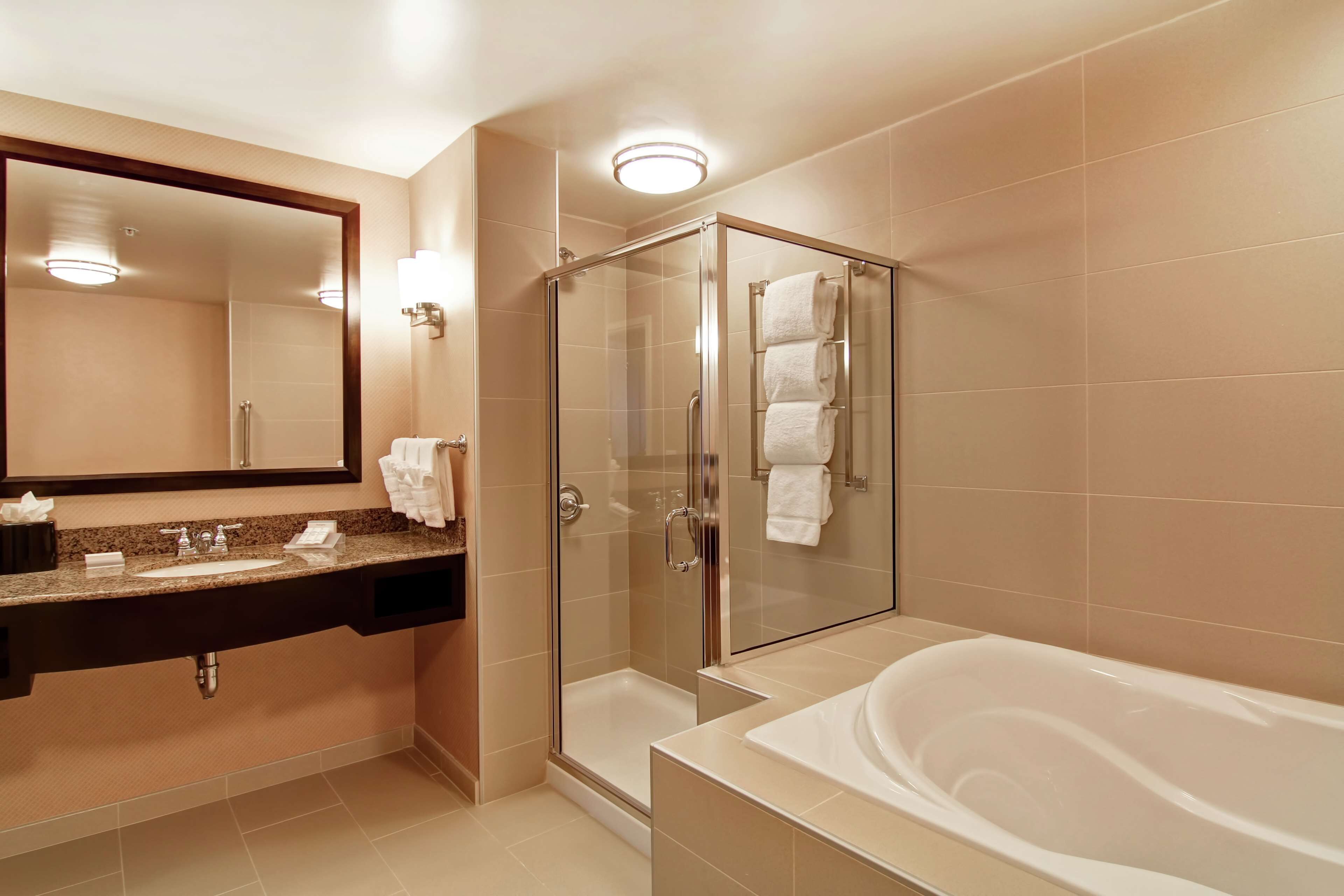 king, suite, 1 king bed, non smoking | bathroom | free toiletries, hair dryer, bathrobes, towels