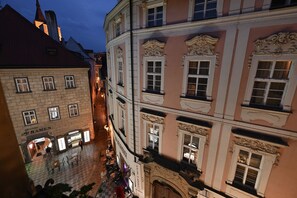 A historic building with ornate architectural details, a courtyard with outdoor seating, and a restaurant named "Ramen" at the ground level. - Boutique Residence by Little King (Prague)