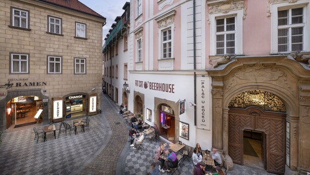 A street with outdoor seating at a beerhouse and a restaurant. - Boutique Residence by Little King (Prague)
