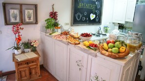 A breakfast buffet with various food items and a chalkboard sign that reads "Have a nice BREAKFAST." - Villa Ines (Venice)