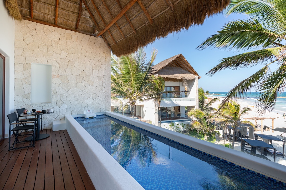 balcony area with private pool and a view of the ocean