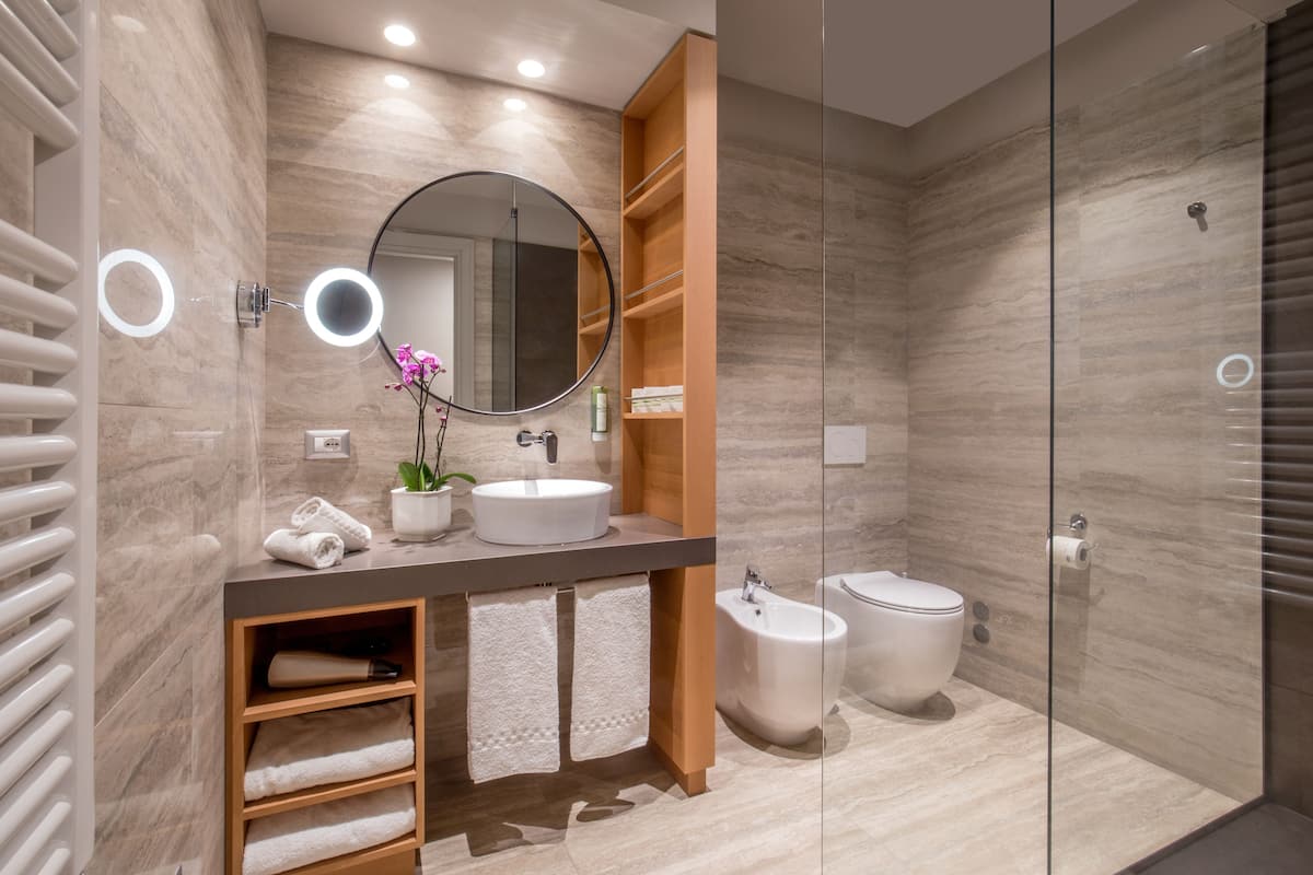 shower, hair dryer, bidet, towels