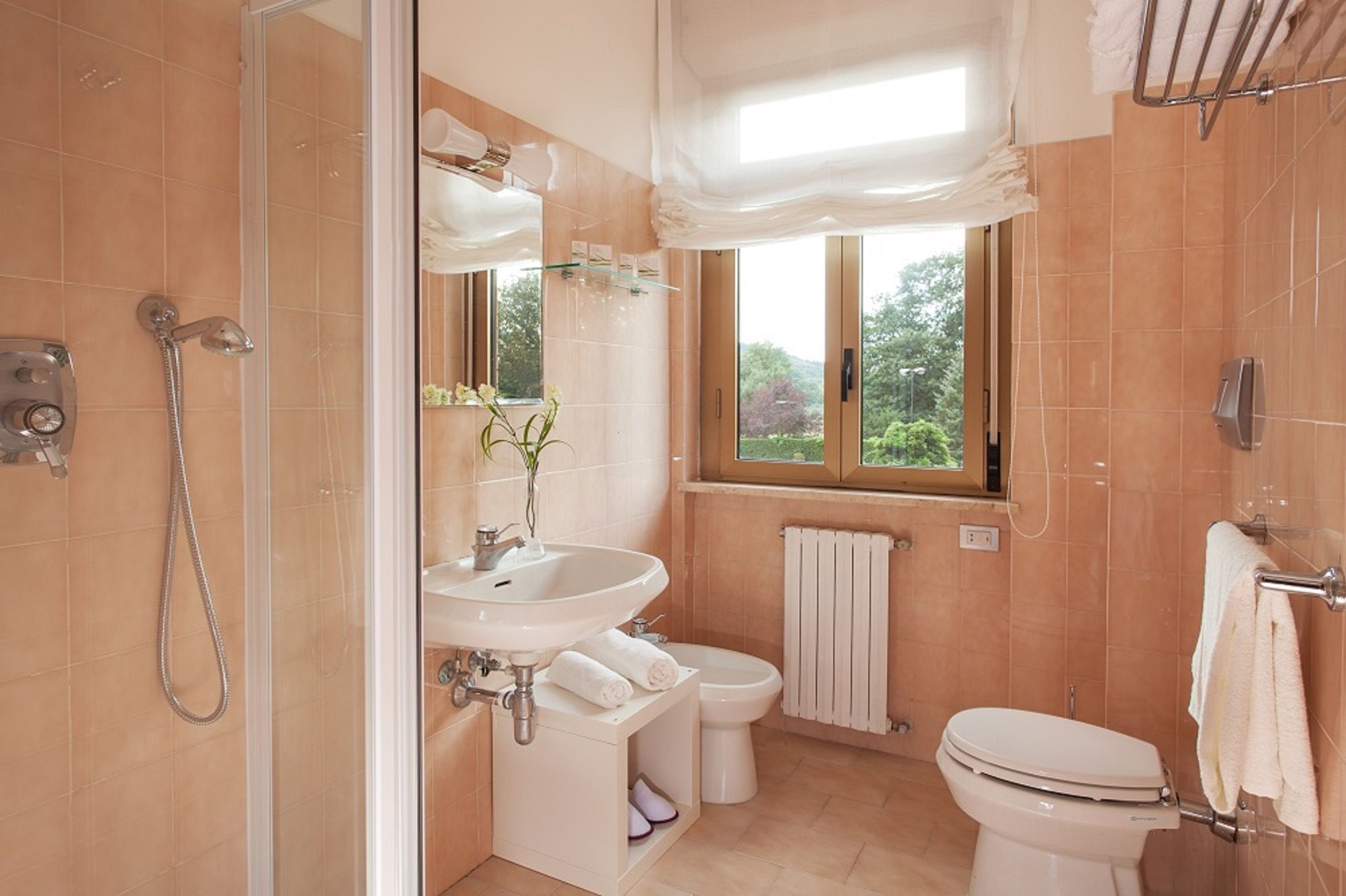 shower, hair dryer, bidet, towels