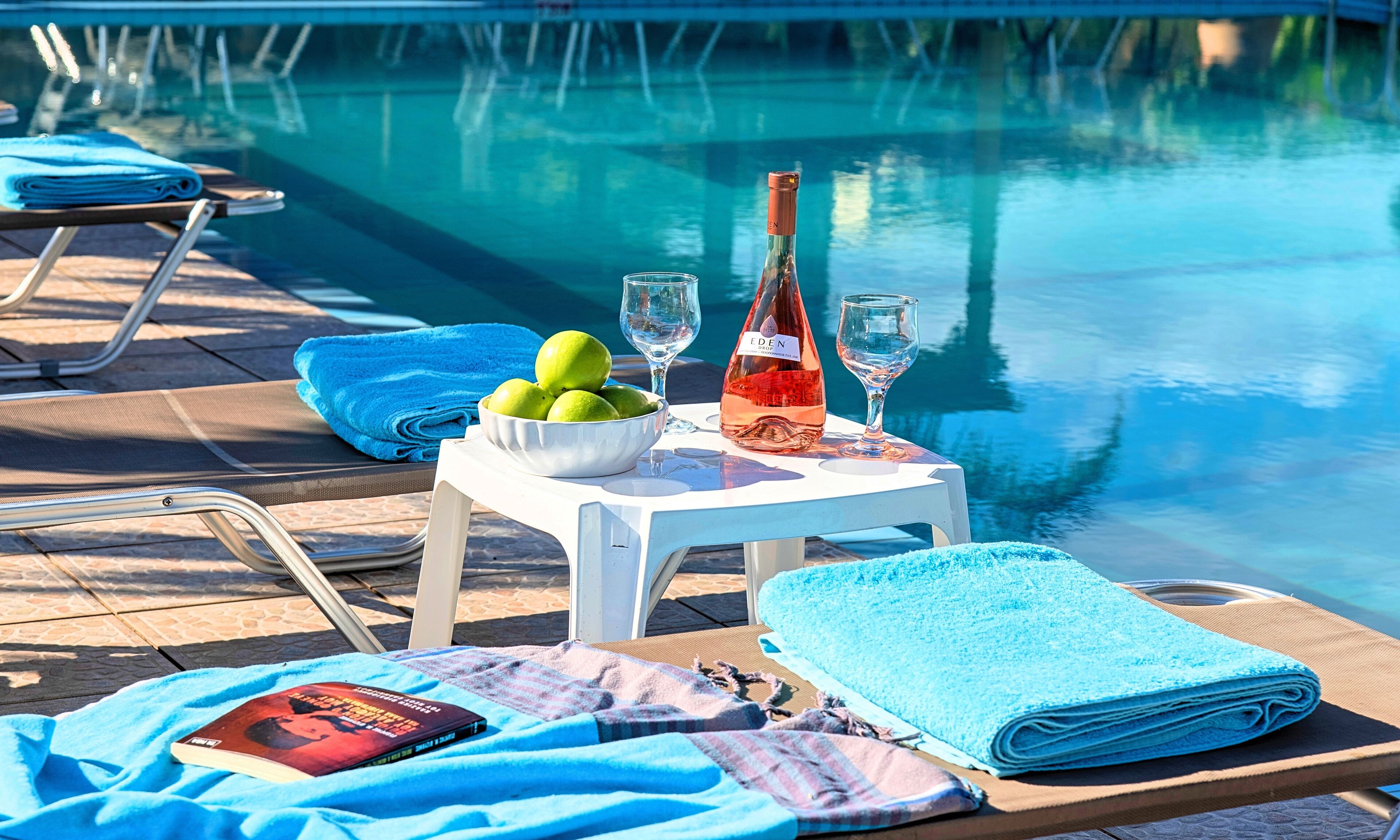 seasonal outdoor pool, pool umbrellas, pool loungers