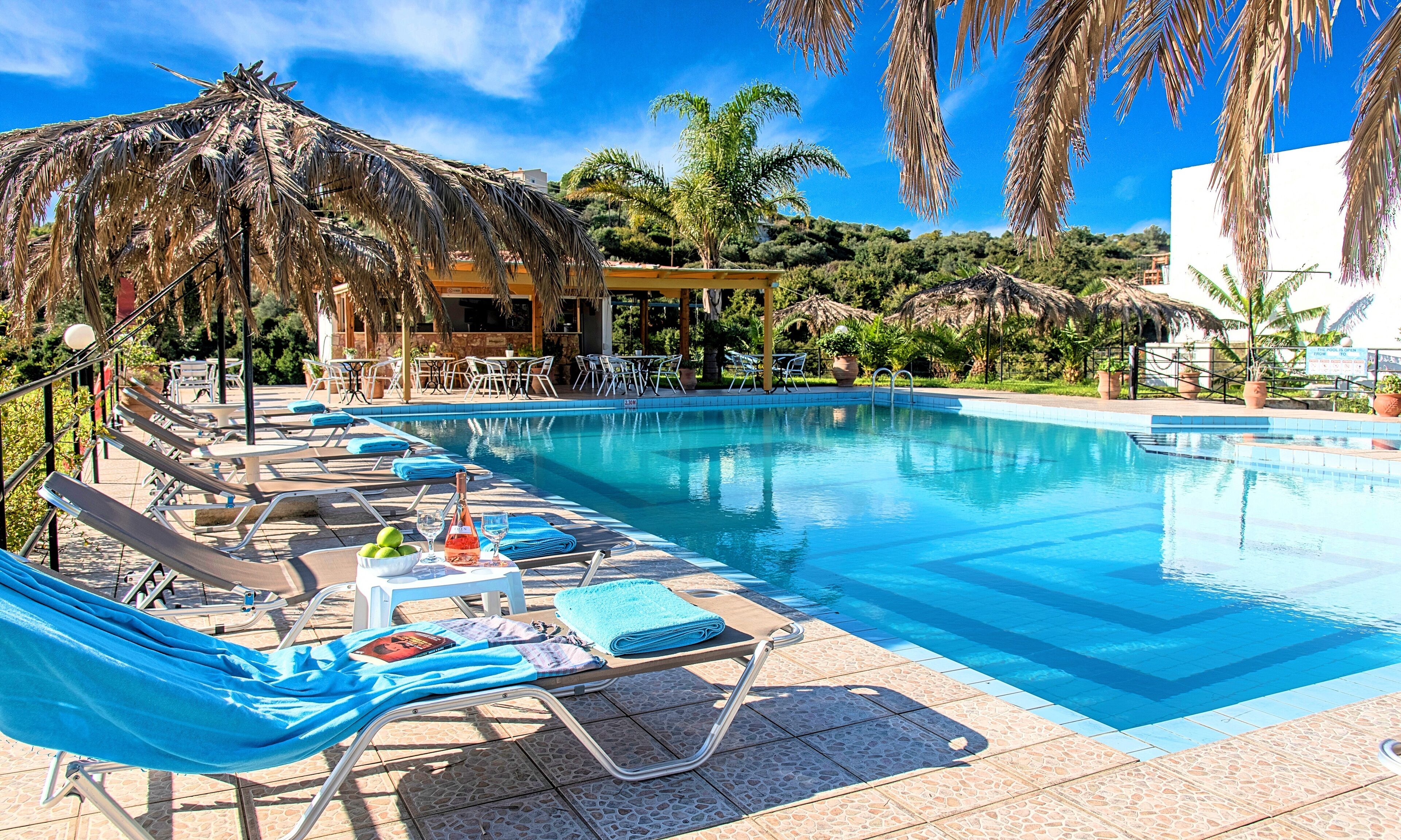 Seasonal outdoor pool, pool umbrellas, pool loungers