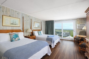 A hotel room with two beds, a balcony with a view, and a desk with a chair. - The Vista (Gloucester)