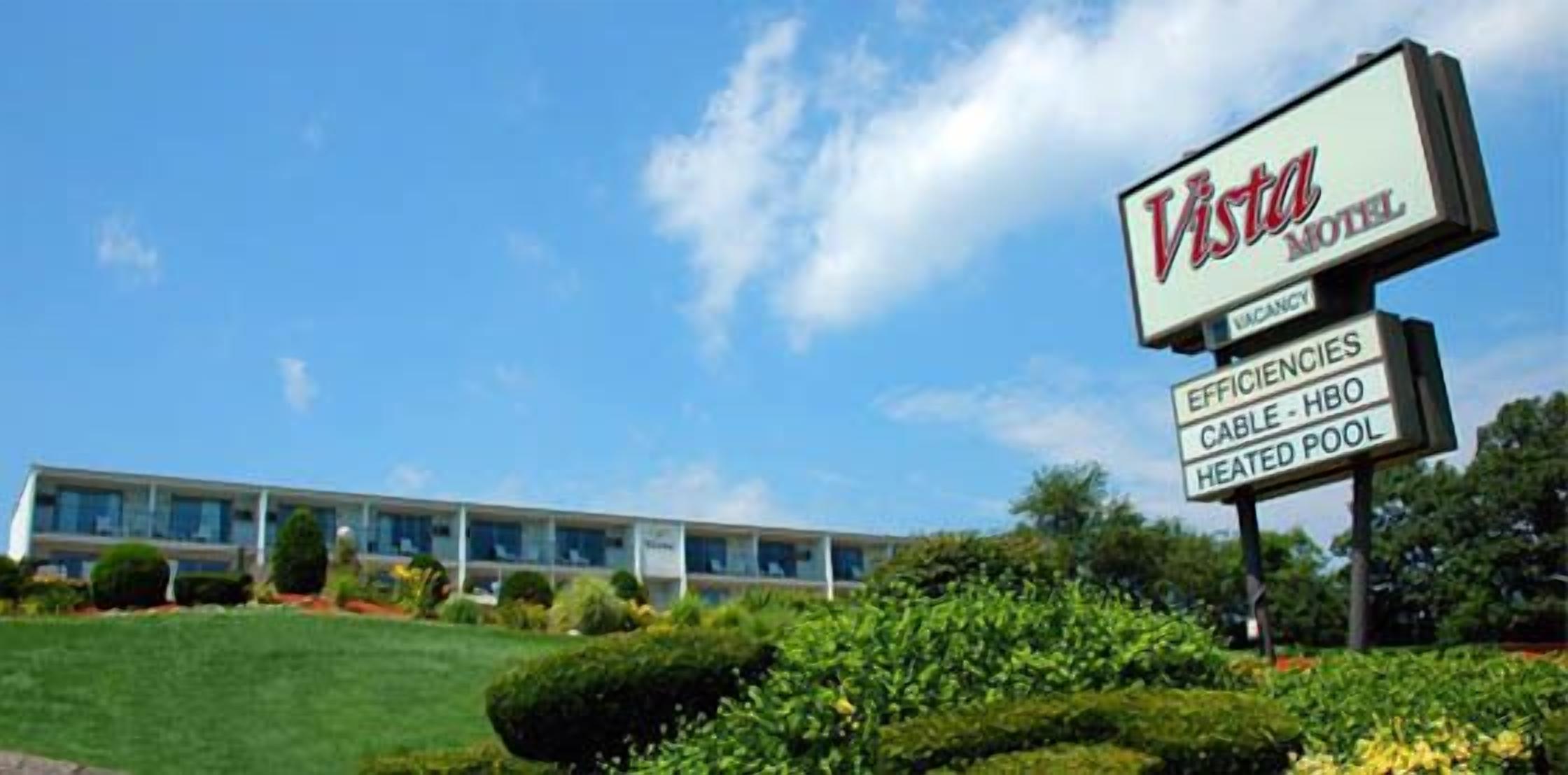 A Vista Motel sign with amenities including cable, HBO, and a heated pool.