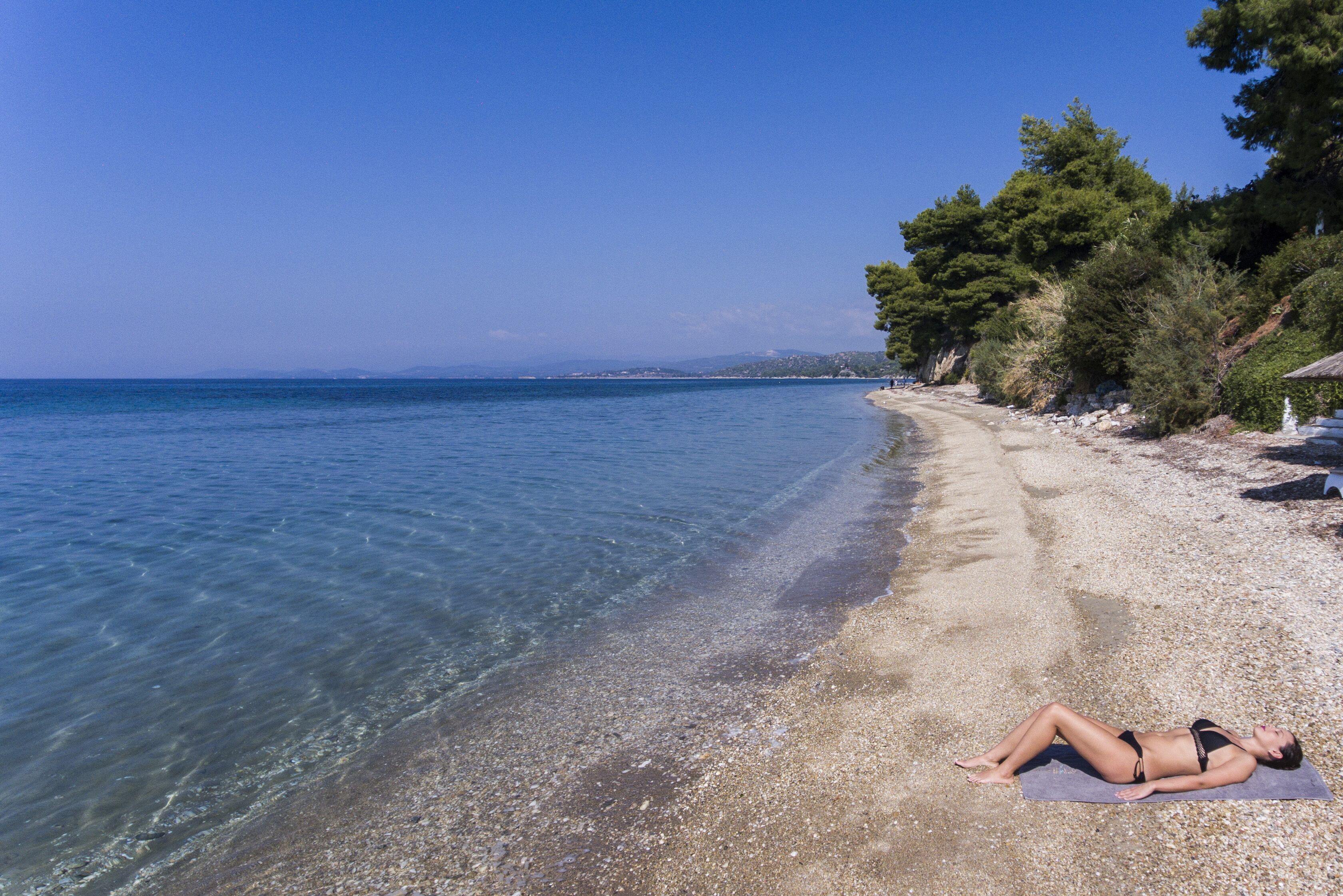 Platja privada, gandules de platja i para-sols per a la platja 