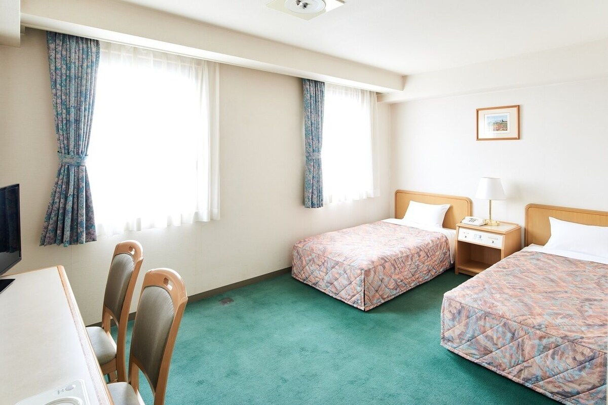 Desk, blackout curtains, free WiFi, bed sheets