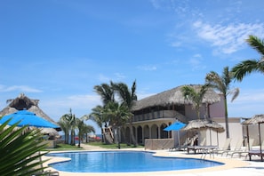 Outdoor pool, open 6:00 AM to 10:00 PM, sun loungers