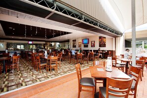 Enjoy a casual dining experience in our restaurant with a spacious layout and modern design.