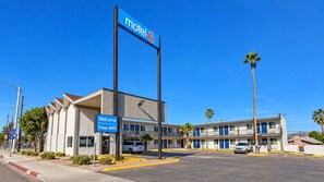 A motel with a sign indicating 'motel 6' and a welcome sign for 'Free WIFI'. - Motel 6 Blythe, CA - South (Blythe)