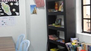 A room with a desk, chairs, a bookshelf, and a window. - Submarine Guest House Central Market - Hostel (Kuala Lumpur)