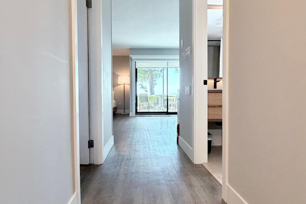 Deluxe Double Room, Oceanfront | Desk, laptop workspace, iron/ironing board, free WiFi