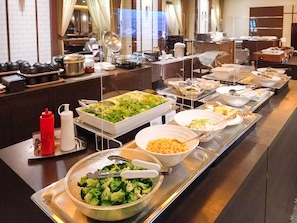 A buffet setup with various food items and condiments. - Hotel Grand Terrace Toyama (Toyama)