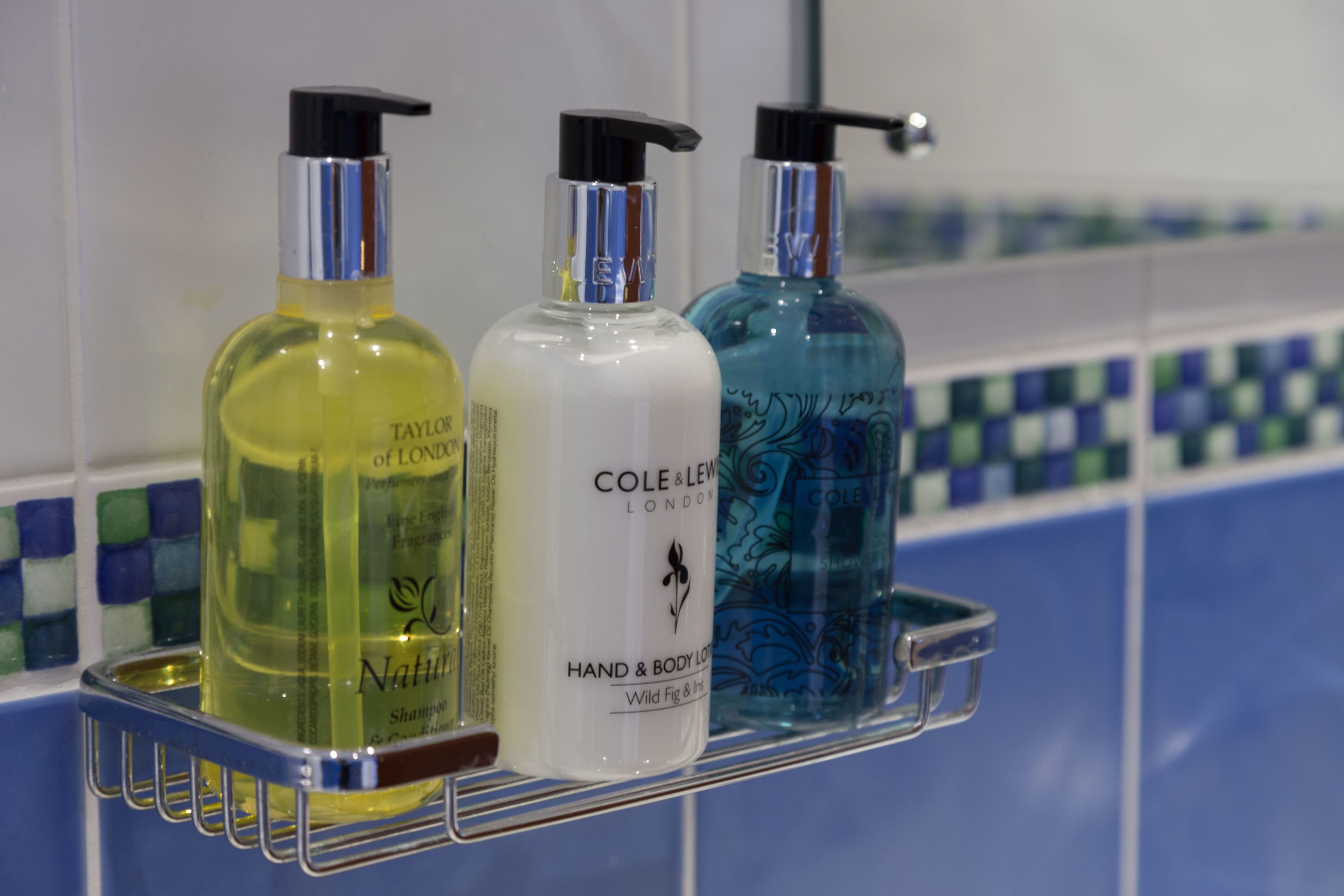 designer toiletries, hair dryer, towels, soap