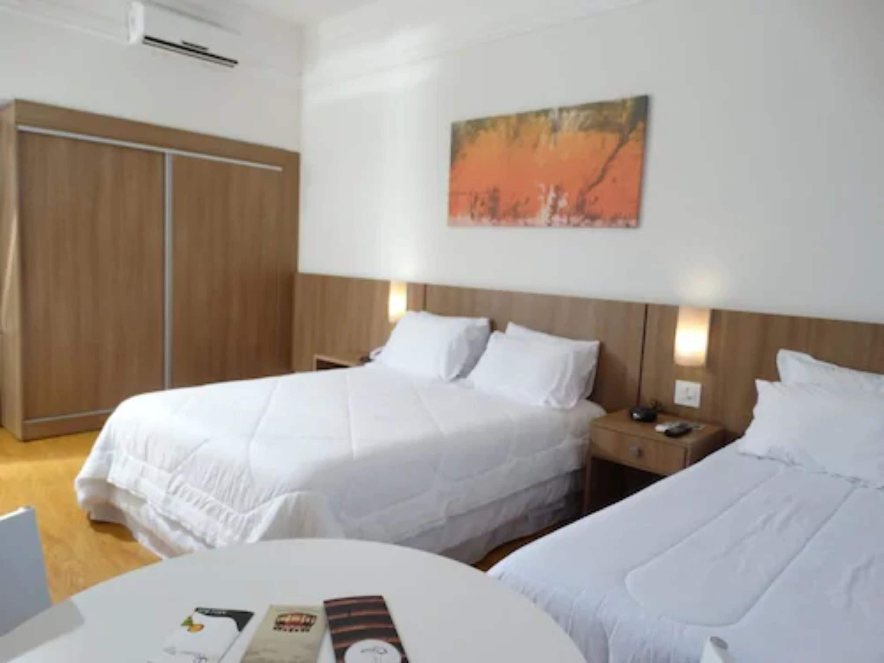 deluxe triple room | minibar, in-room safe, desk, blackout curtains