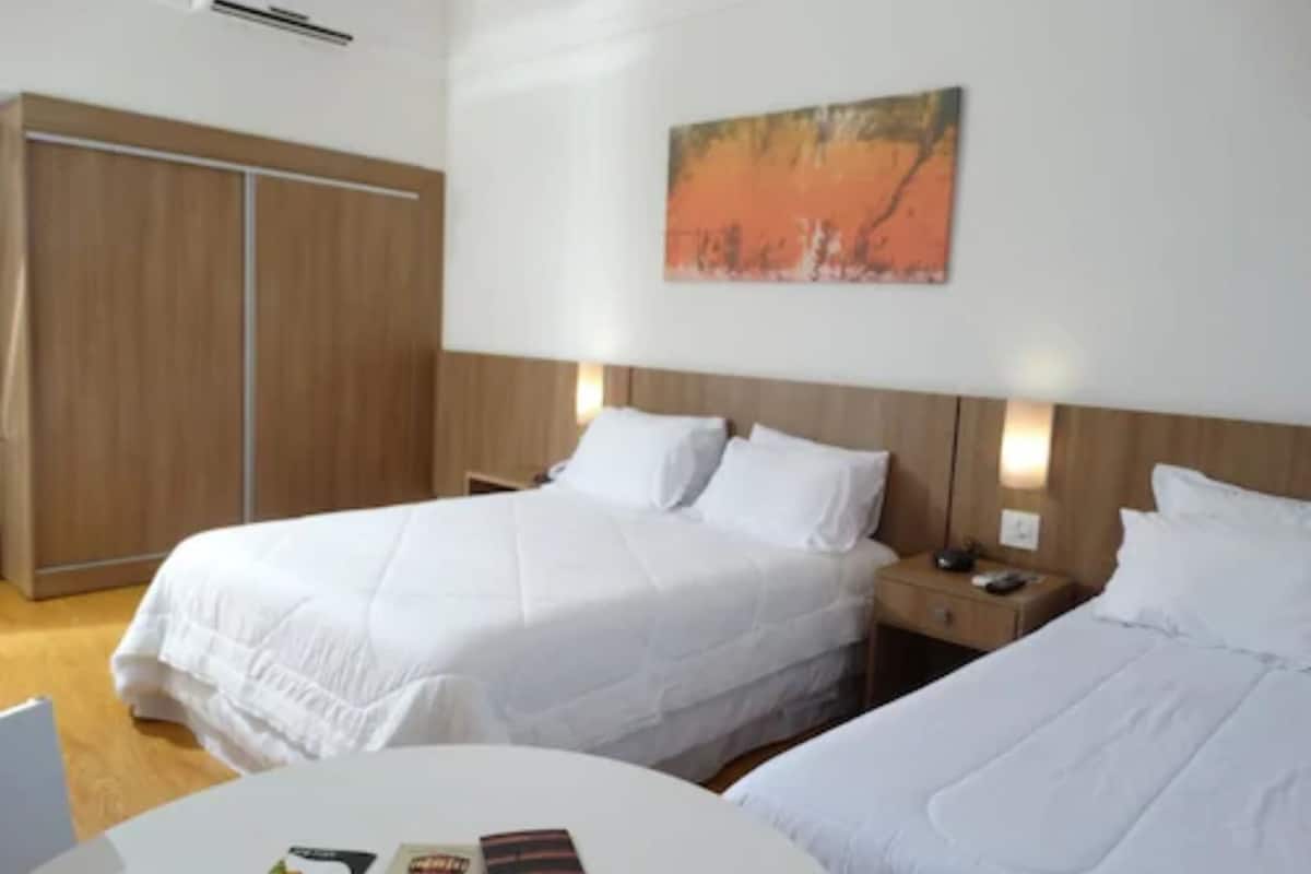 deluxe triple room | minibar, in-room safe, desk, blackout curtains