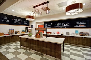 Bakery counter with a variety of fresh baked goods on display.