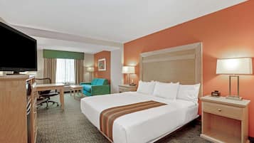 Premium bedding, desk, laptop workspace, blackout curtains