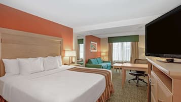 Premium bedding, desk, laptop workspace, blackout drapes