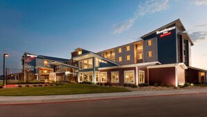 A multi-story hotel with a modern design, featuring large windows and a flat roof. - Residence Inn by Marriott San Angelo (San Angelo)