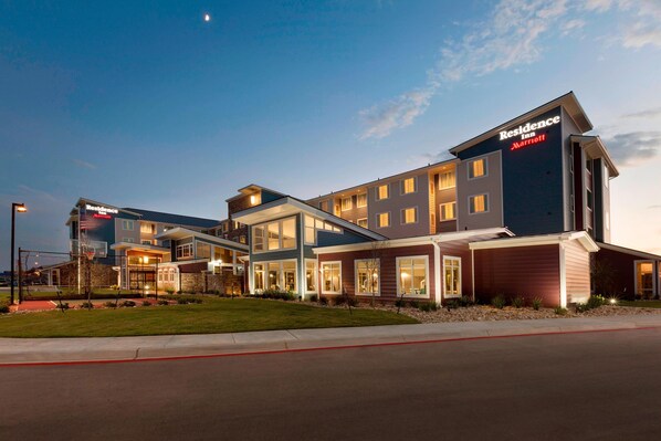 A multi-story hotel with a modern design, featuring large windows and a flat roof. - Residence Inn by Marriott San Angelo (San Angelo)