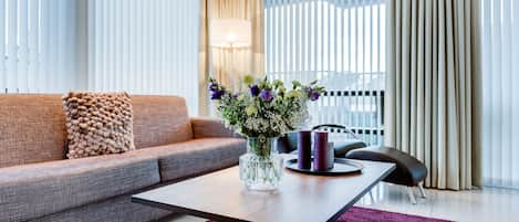 Deluxe Suite, 1 Bedroom, Balcony | Living area | LCD TV, heated floors