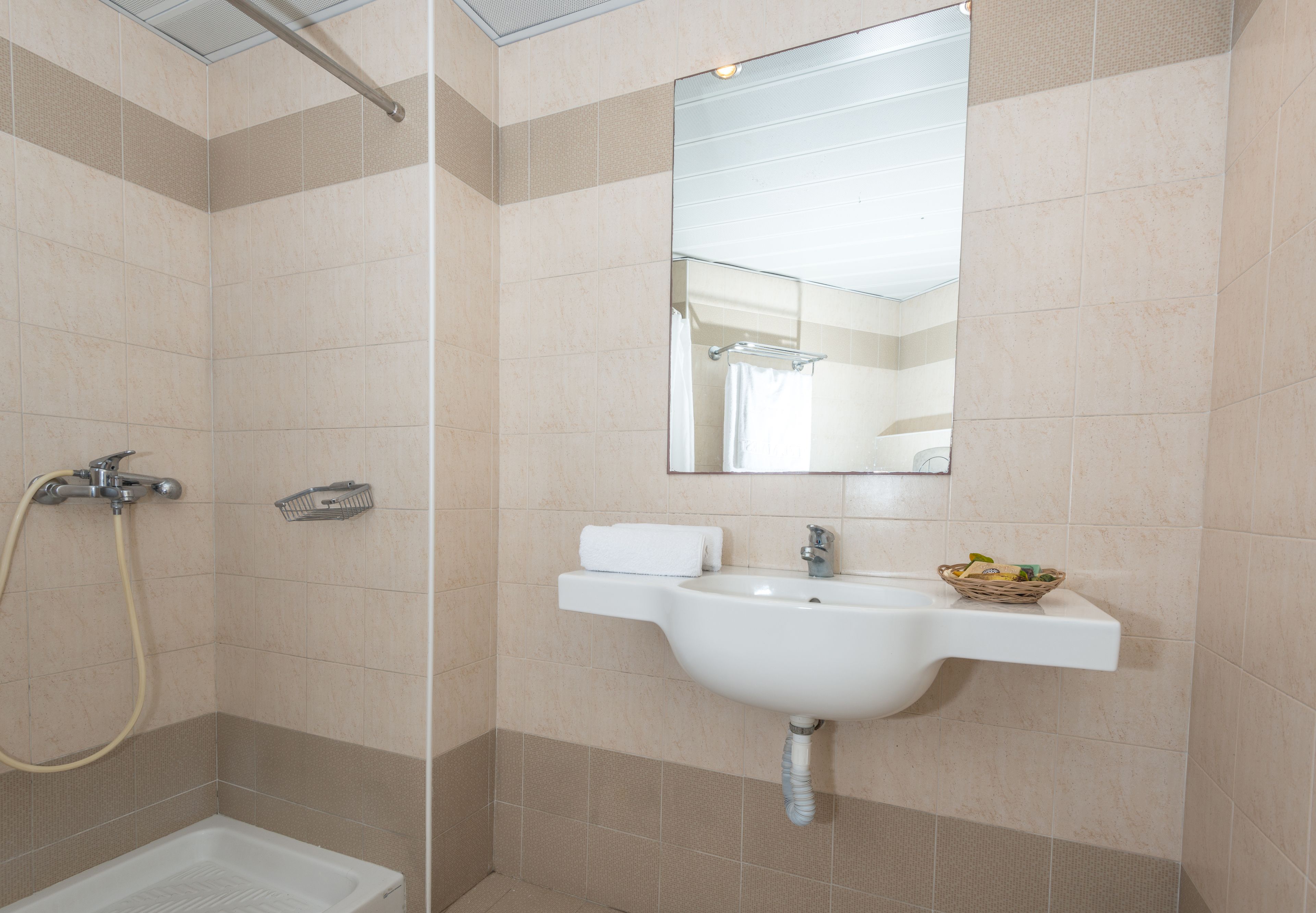 bathroom | hair dryer, slippers, towels