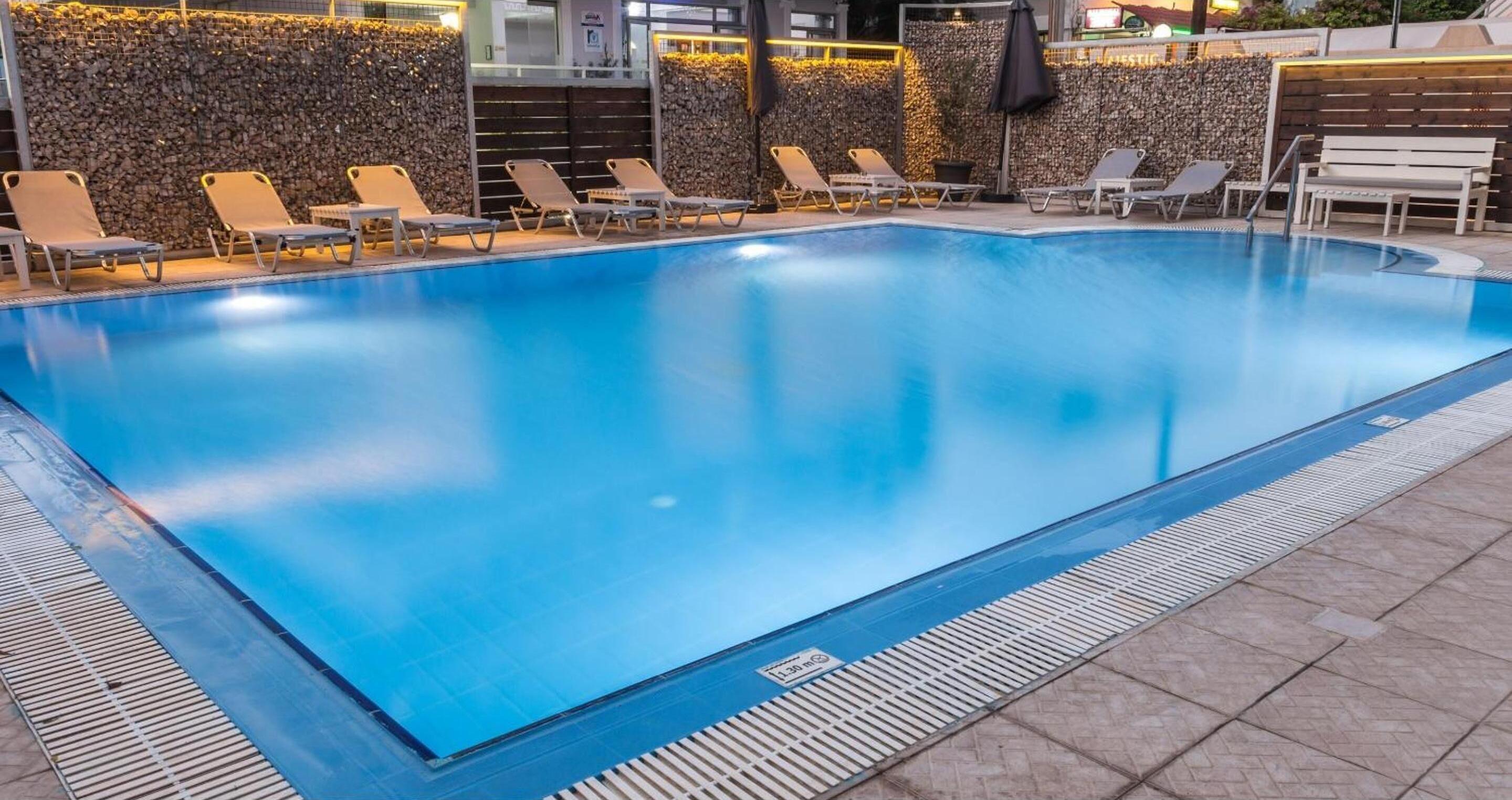 outdoor pool, pool umbrellas, pool loungers