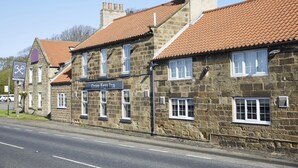 A stone building with a sign for 'Cross Keys Inn' and a road in front. - Cross Keys Hotel by Chef and Brewer Collection (Guisborough)