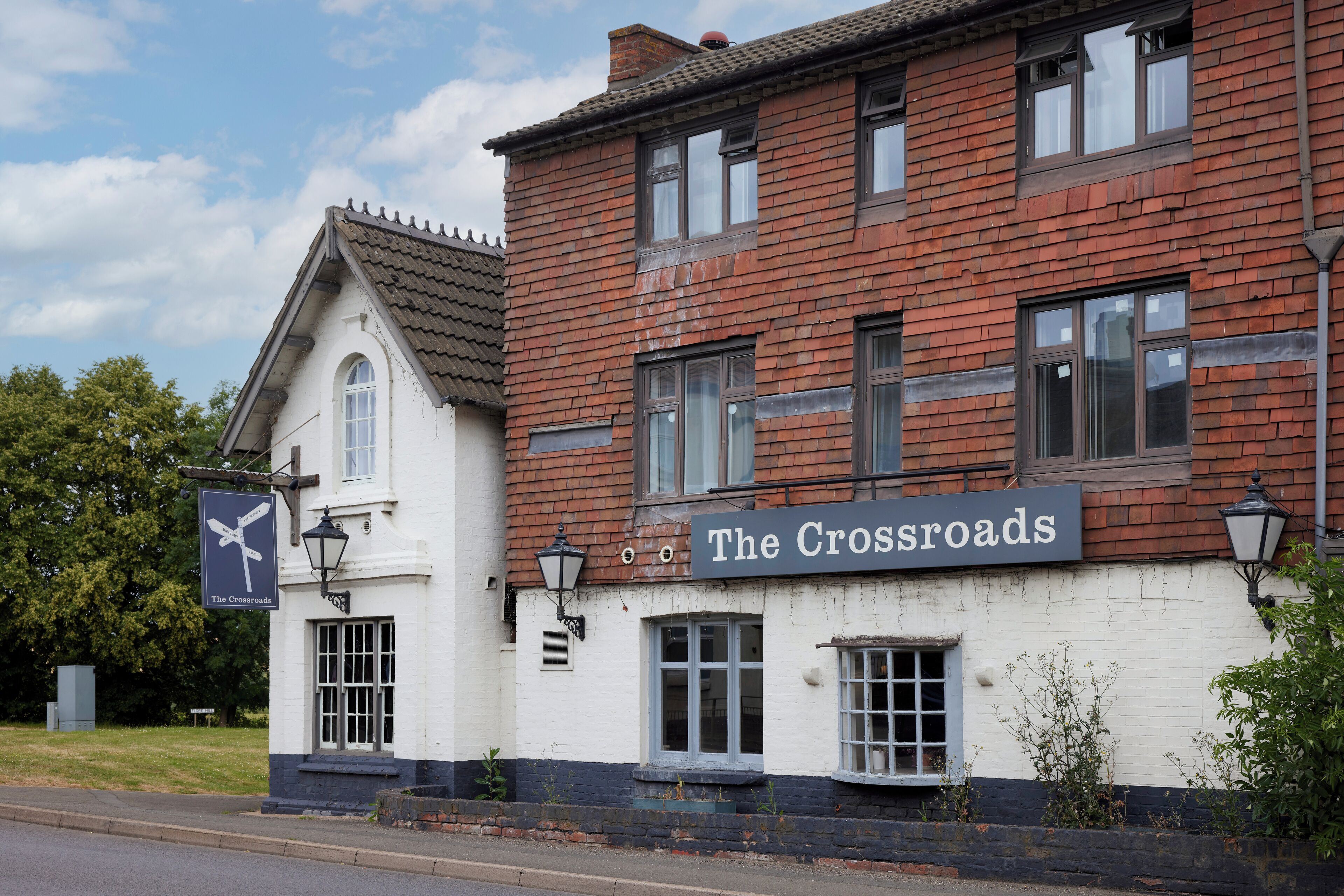 A traditional building with a sign reading "The Crossroads."