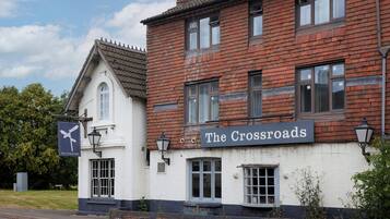 A traditional building with a sign reading "The Crossroads."