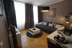 Design Apartment | Living area | 135-cm flat-screen TV with digital channels, LED TV - Apartments-in-vienna (Vienna)