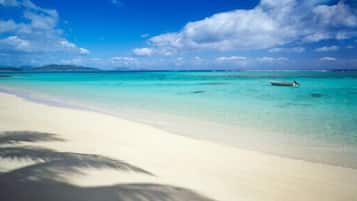 Beach nearby, white sand, scuba diving, surfing