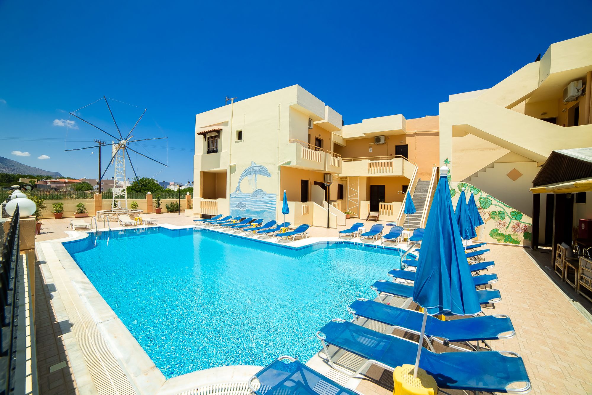 Seasonal outdoor pool, open 9:00 AM to 7:00 PM, pool umbrellas