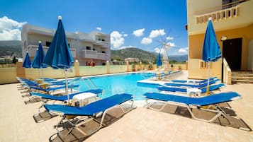 Seasonal outdoor pool, open 9:00 AM to 7:00 PM, pool umbrellas