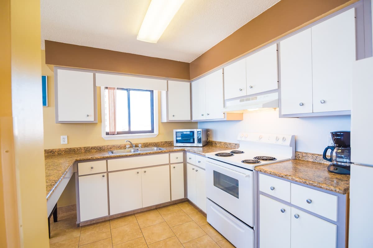 family suite, 1 bedroom, balcony, beach view | private kitchen | fridge, microwave, oven, stovetop