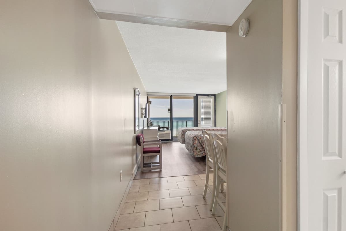 studio, 2 queen beds, balcony, beach view | 1 bedroom, laptop workspace, iron/ironing board, cots/infant beds