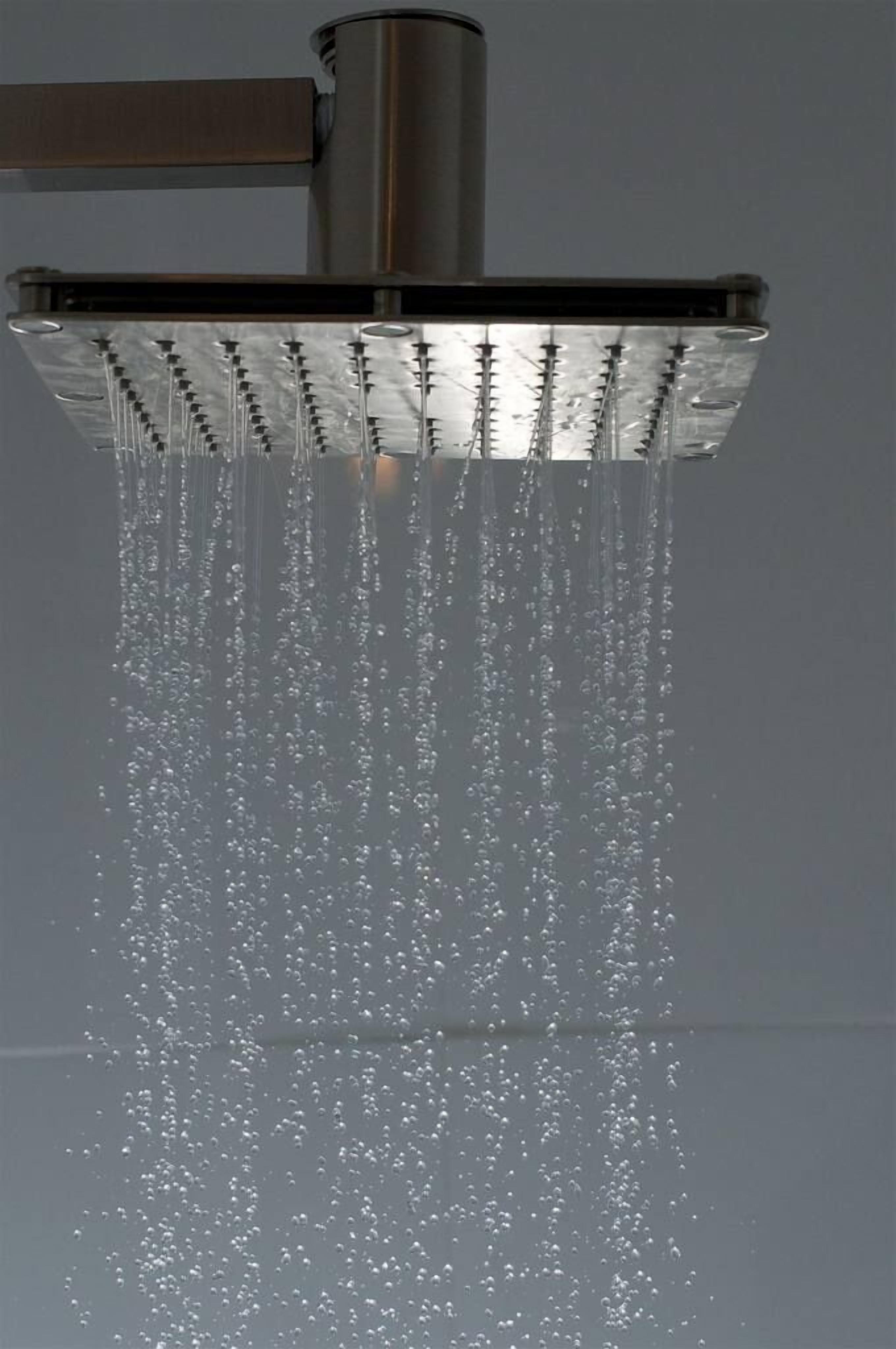 A showerhead with multiple nozzles, water flowing from it.
