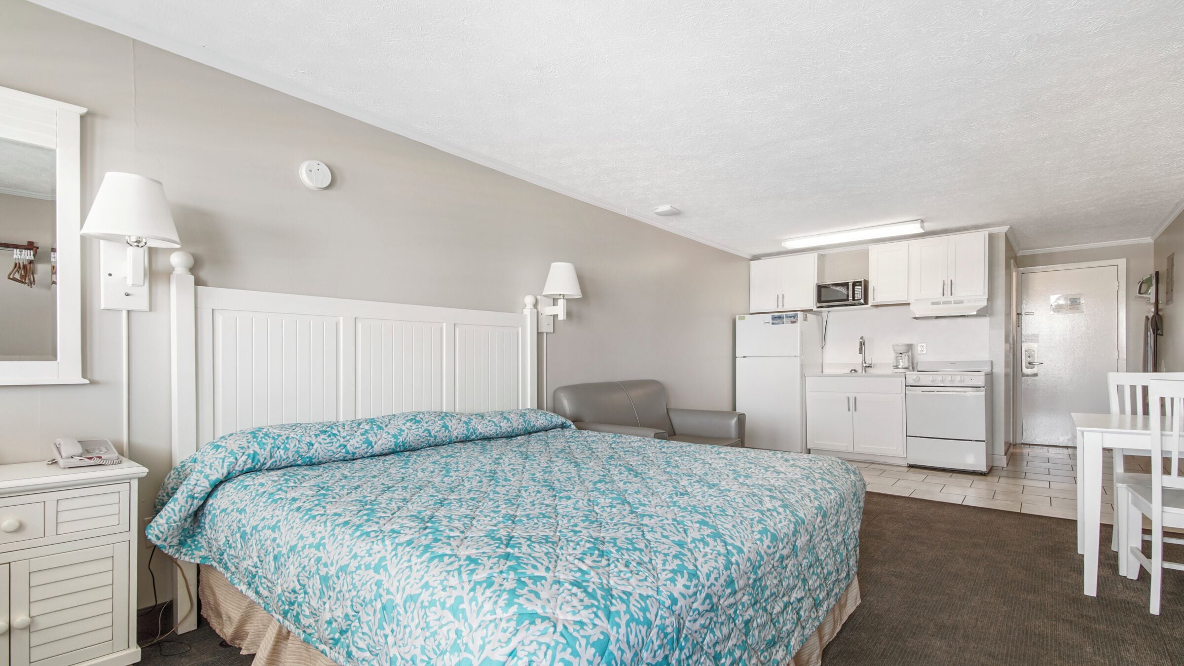 desk, laptop workspace, iron/ironing board, cots/infant beds