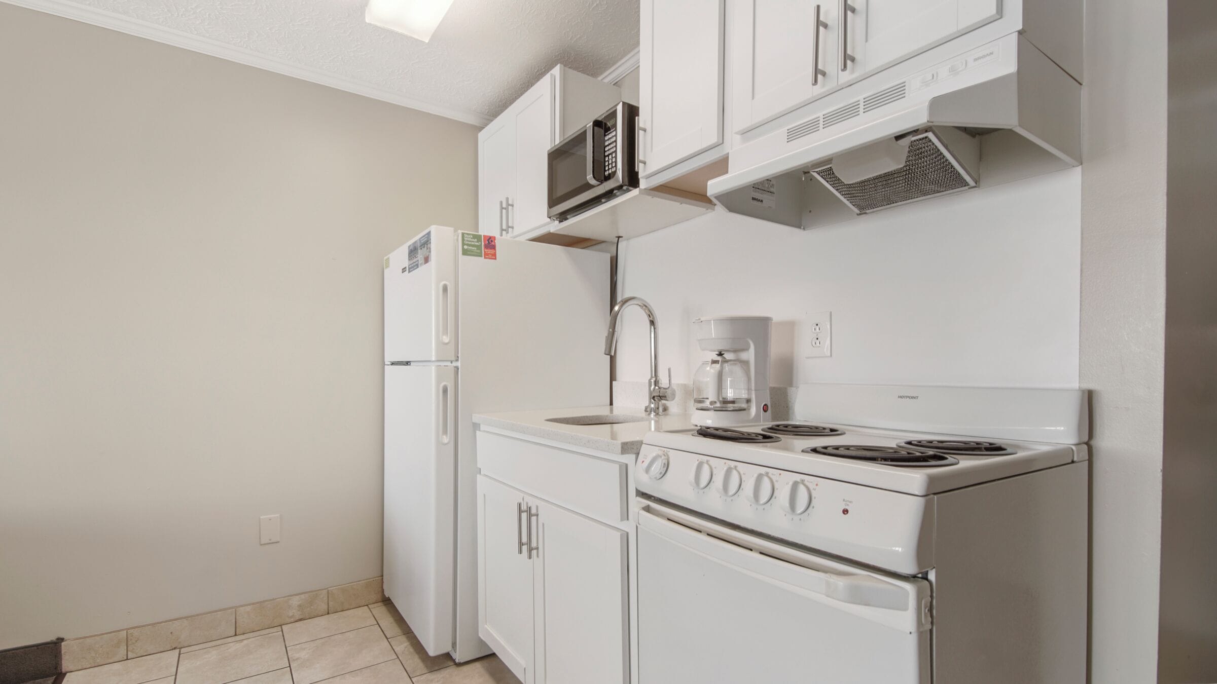 comfort studio, 1 king bed with sofa bed, kitchen, beach view | private kitchenette | fridge, microwave, oven, stovetop