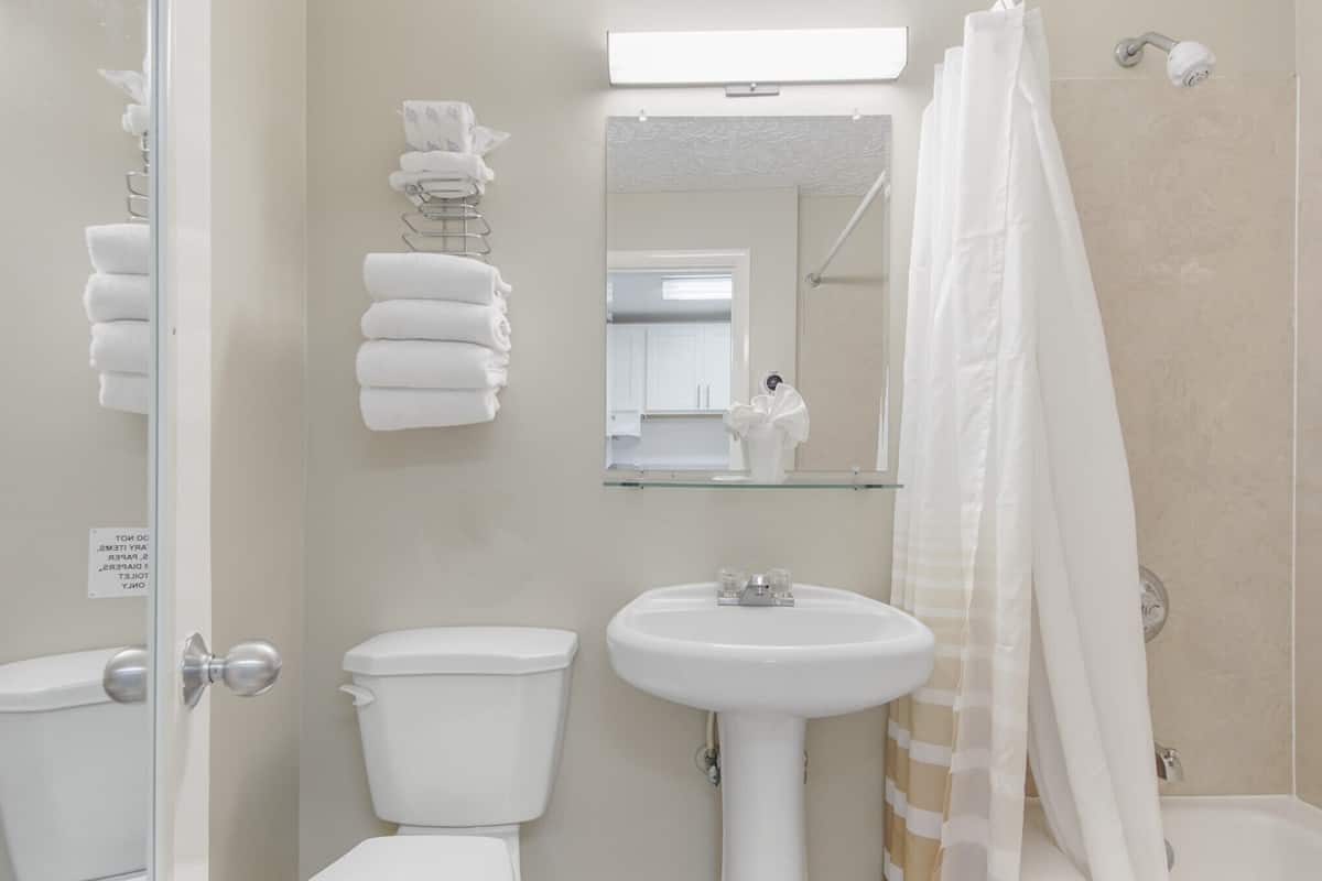 comfort studio, 1 king bed with sofa bed, kitchen, beach view | bathroom | combined shower/bathtub, hair dryer, towels, soap