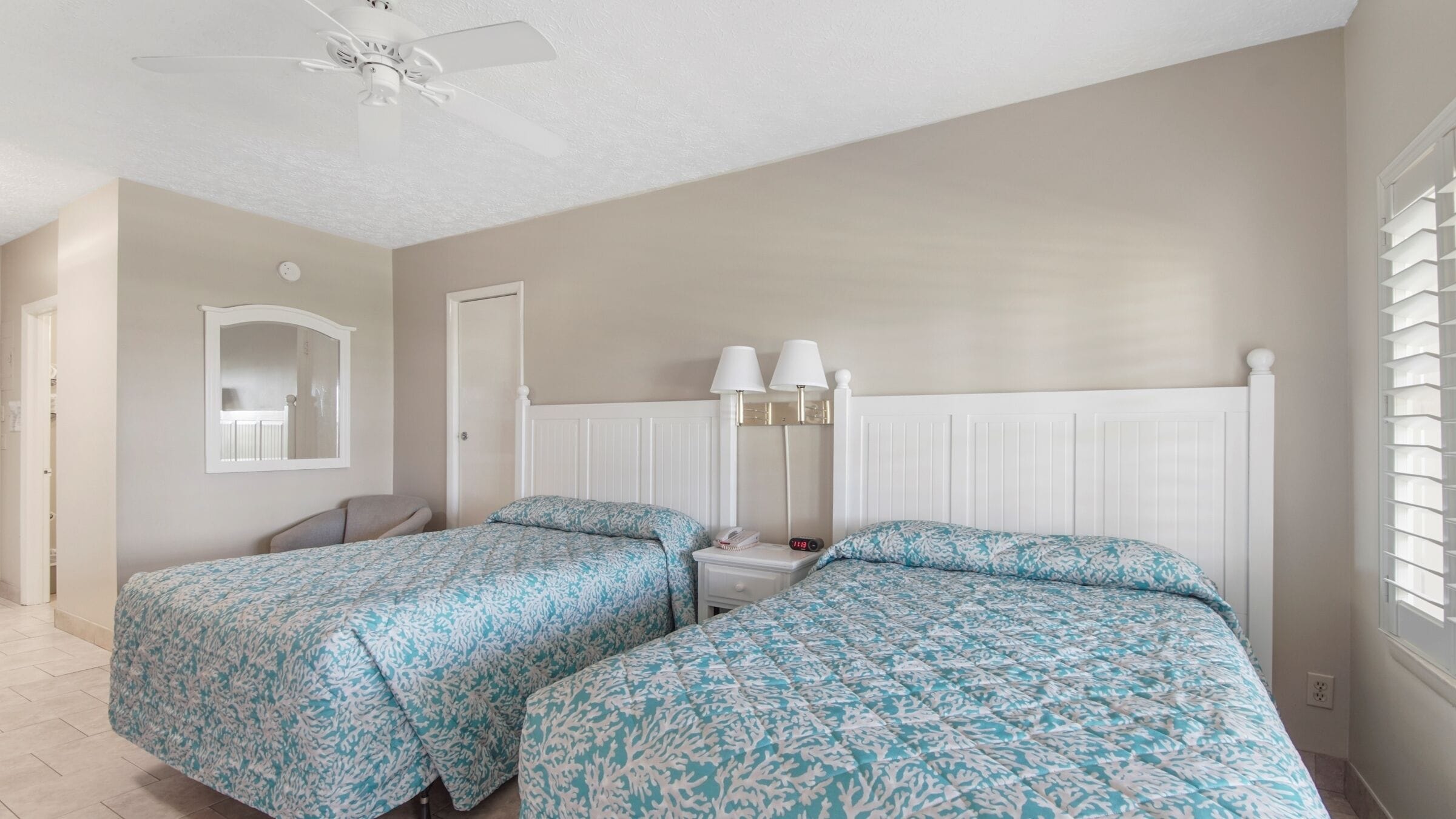 desk, laptop workspace, iron/ironing board, cots/infant beds