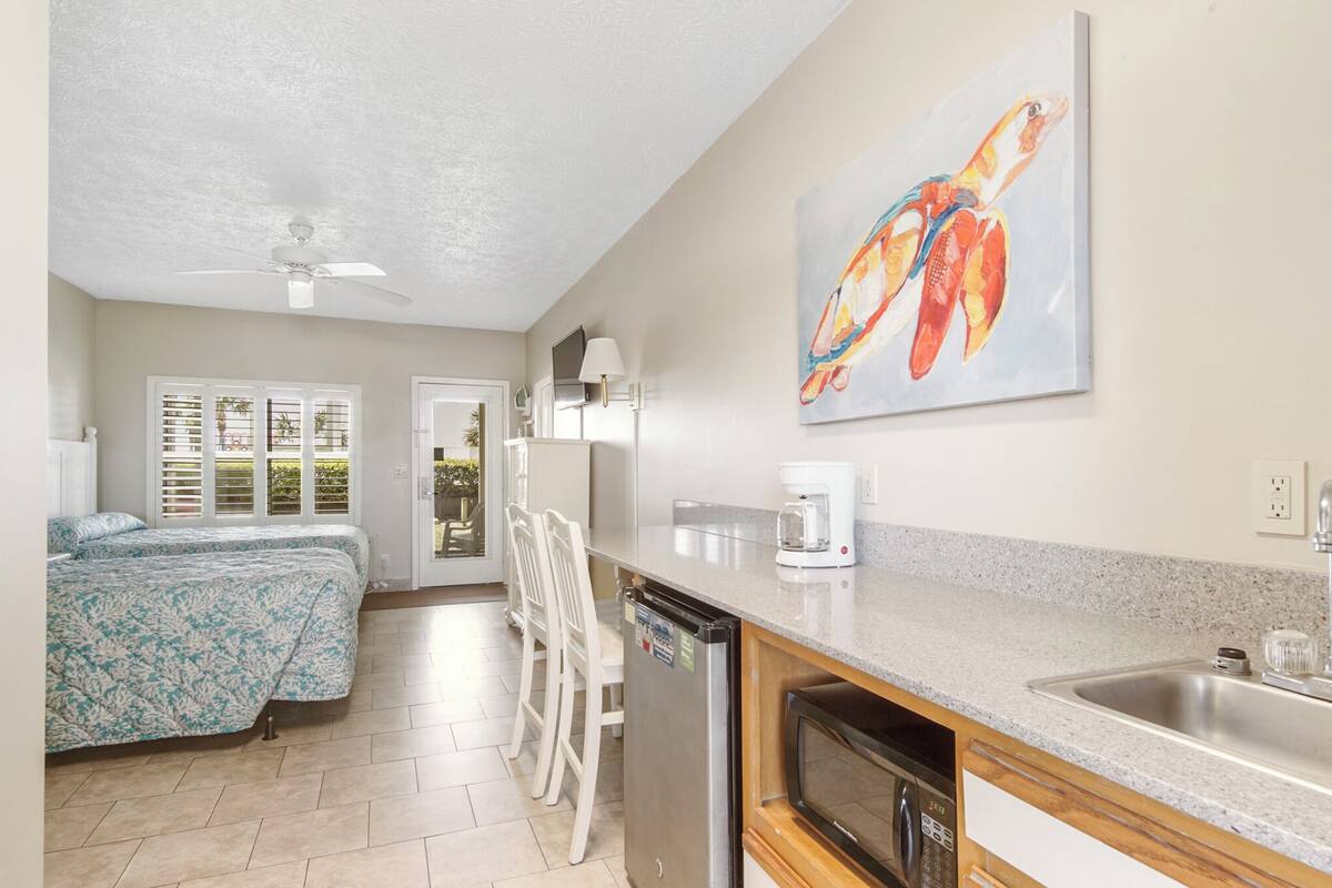 desk, laptop workspace, iron/ironing board, cots/infant beds