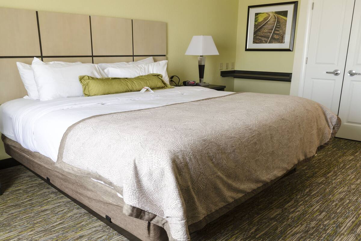 desk, laptop workspace, blackout curtains, iron/ironing board